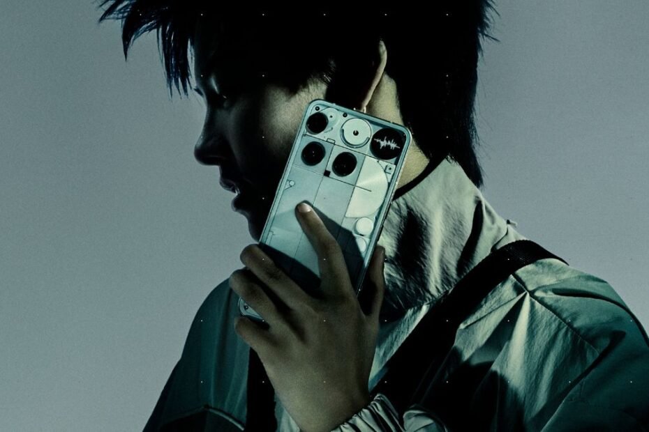 Man holding the transparent Nothing Phone 3 smartphone, showcasing its unique design and Glyph interface.